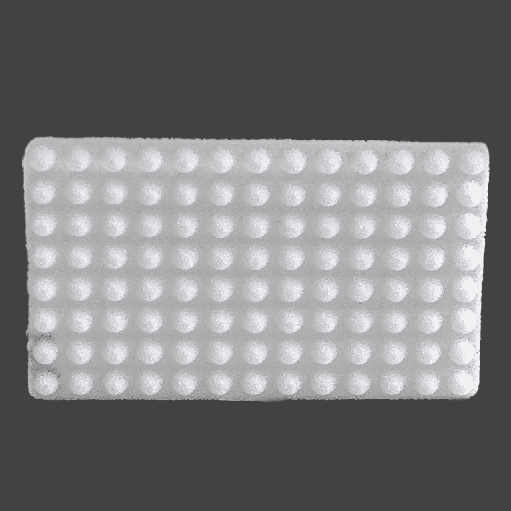 Rectangular white porous polyethylene implant with perforated flexible design